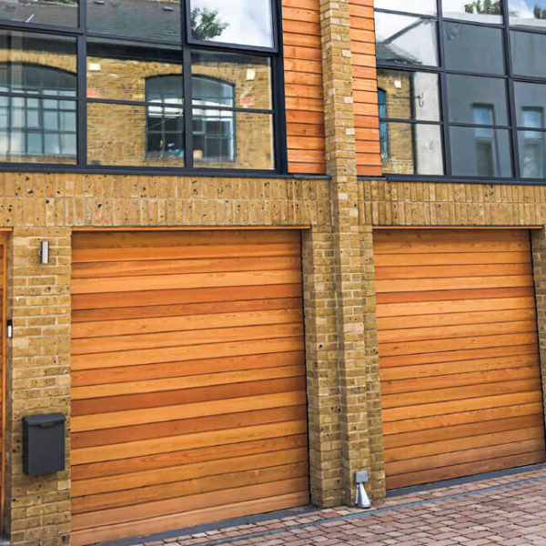 Clad sectional garage door
