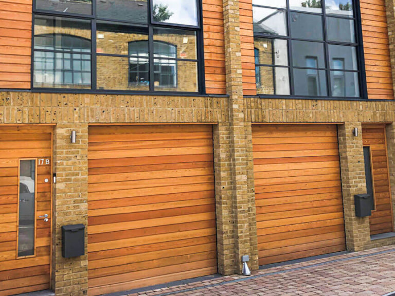 Clad sectional garage door