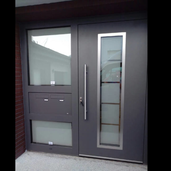 Apartment house front door with a custom made sidelight and 2 integrated letterboxes