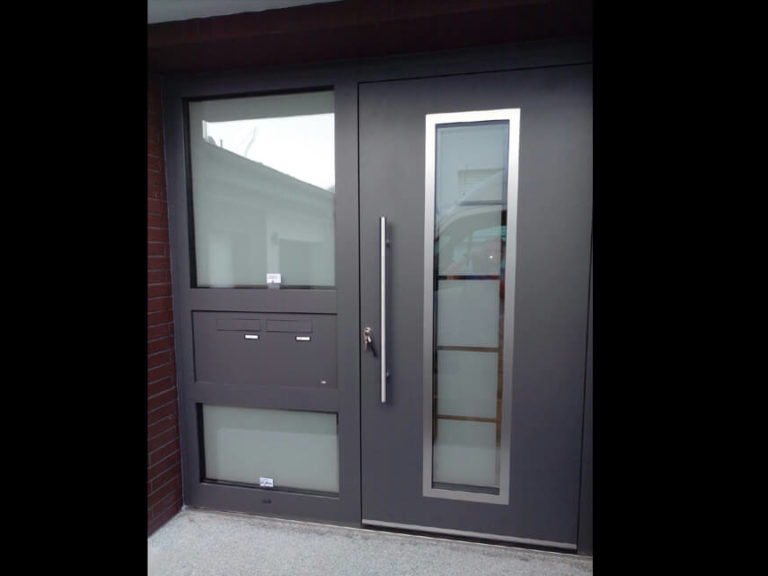 Apartment house front door with a custom made sidelight and 2 integrated letterboxes