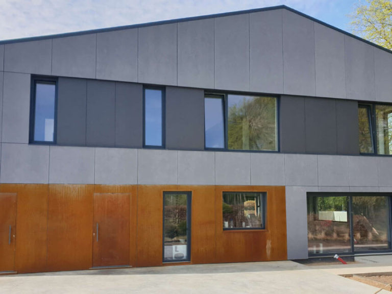 'Concealed' front doors in corten finish