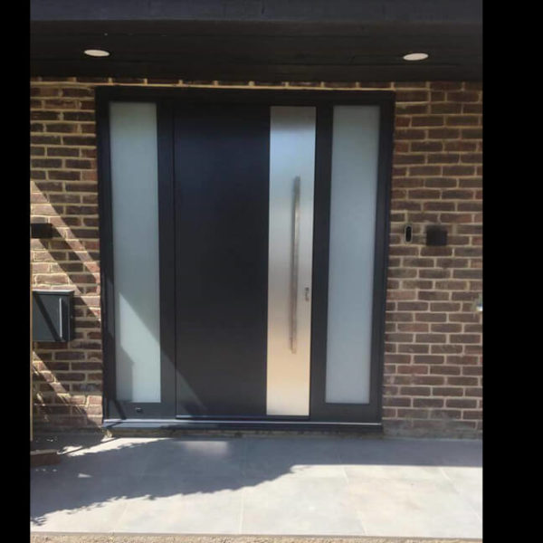 Front door with applique under the handle