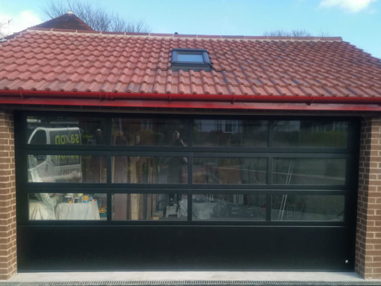 Glazed sectional garage door