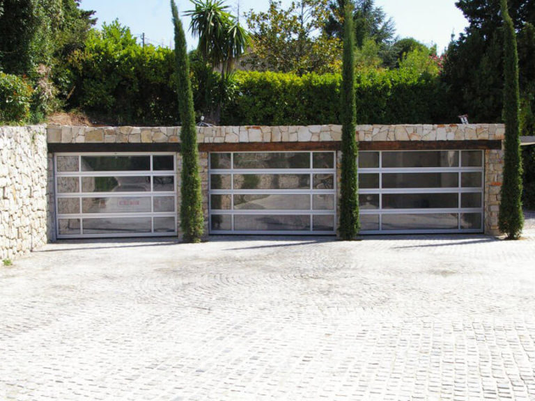 Three garages with glazed doors