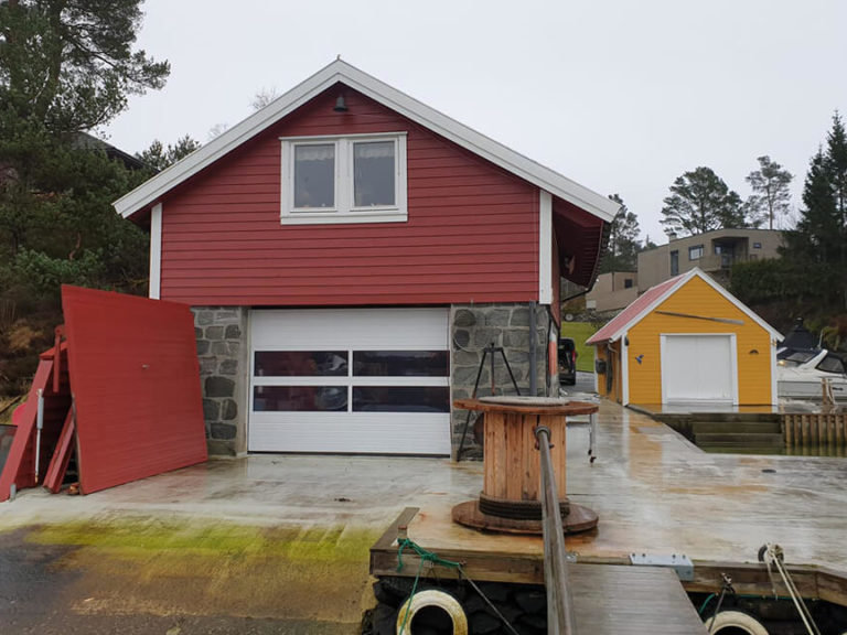 Sectional garage door for boat garage