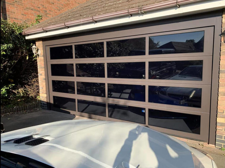 Glazed sectional garage door