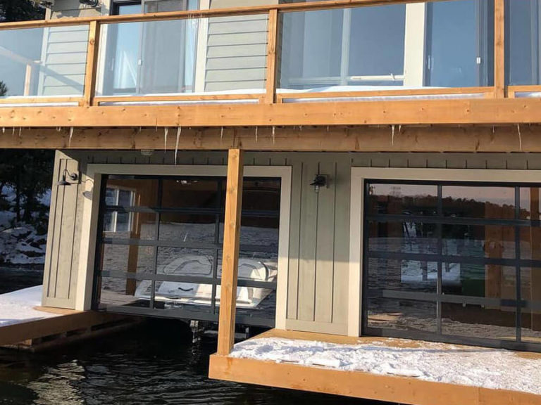 Glazed sectional garage door for boat garage