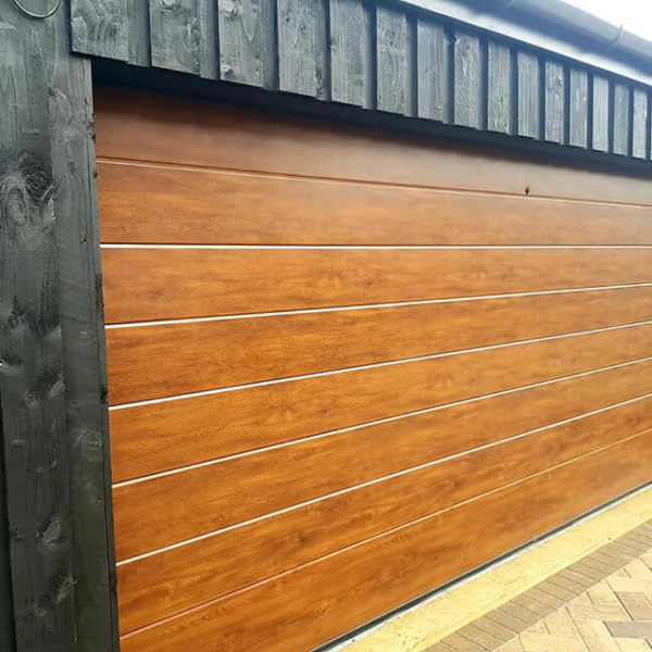 'Midrib' sectional garage door in 'Golden Oak' finish
