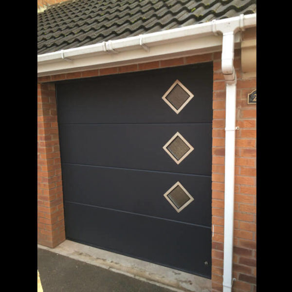 Garage door with diamond shape windows