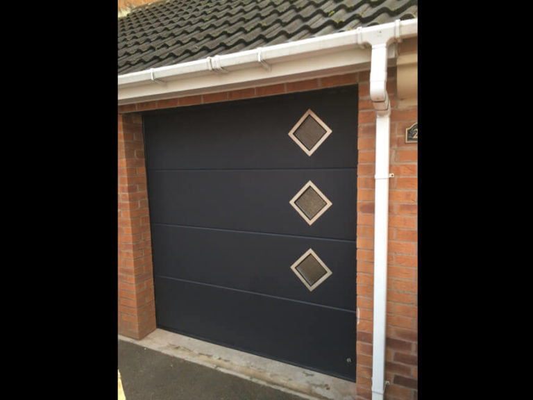Garage door with diamond shape windows