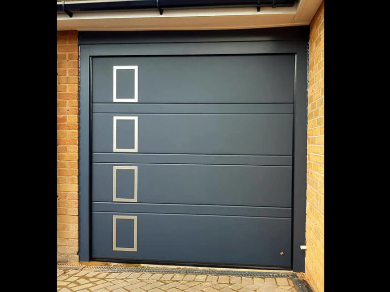 Garage door with 'window style' decor appliques