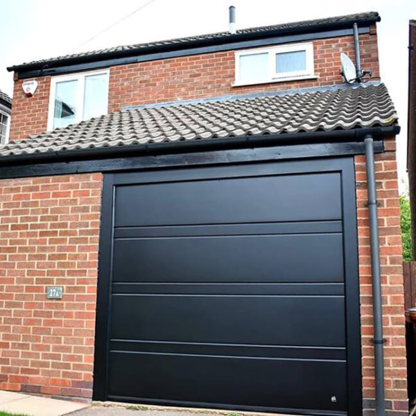 Red bricks house & black 'Toprib' garage door