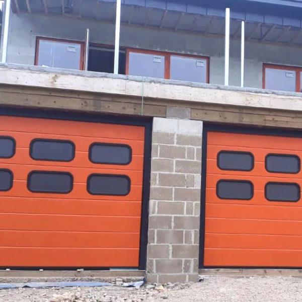 Garage doors with oval PVC windows