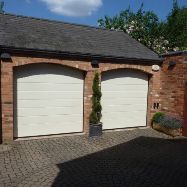 Garage doors in an arched openings