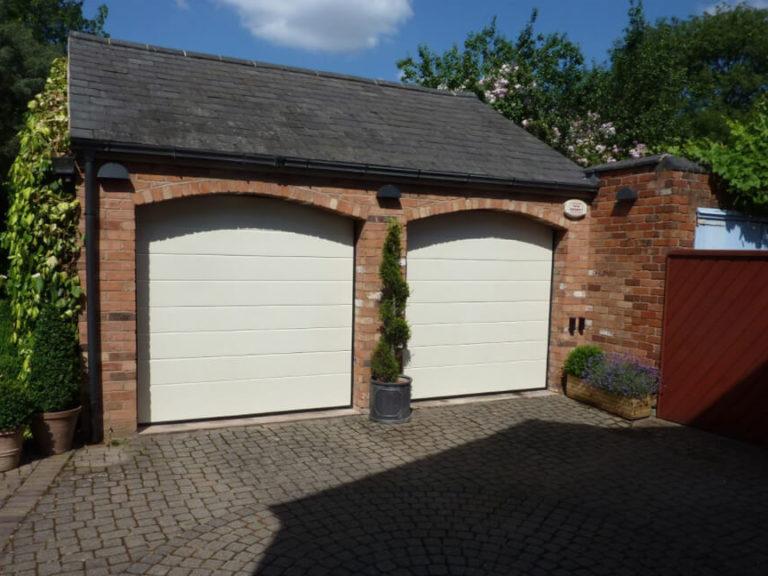 Garage doors in an arched openings