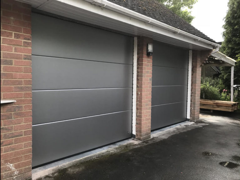 A pair of sectional garage doors
