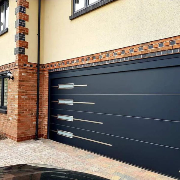 Sectional garage door with appliques & oblong windows