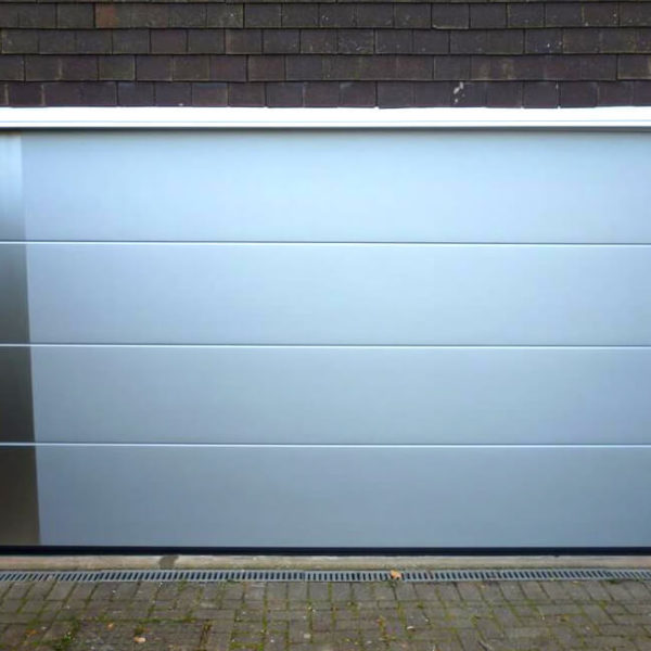 Garage door with decorative applique