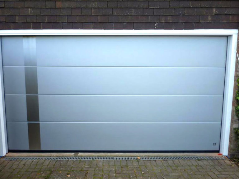 Garage door with decorative applique