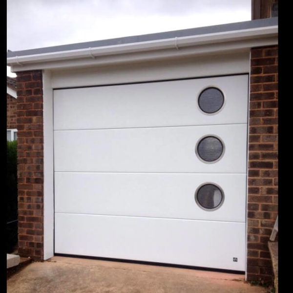 Garage door with 3 big portholes