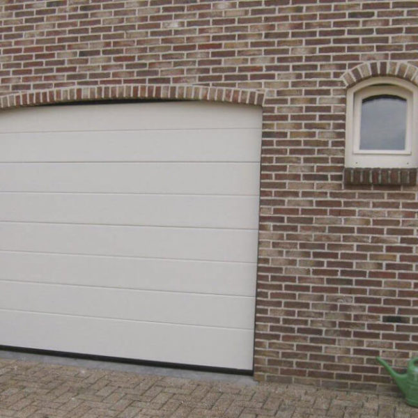 Garage door in an arched opening