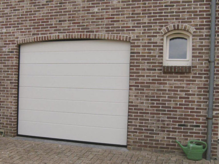 Garage door in an arched opening