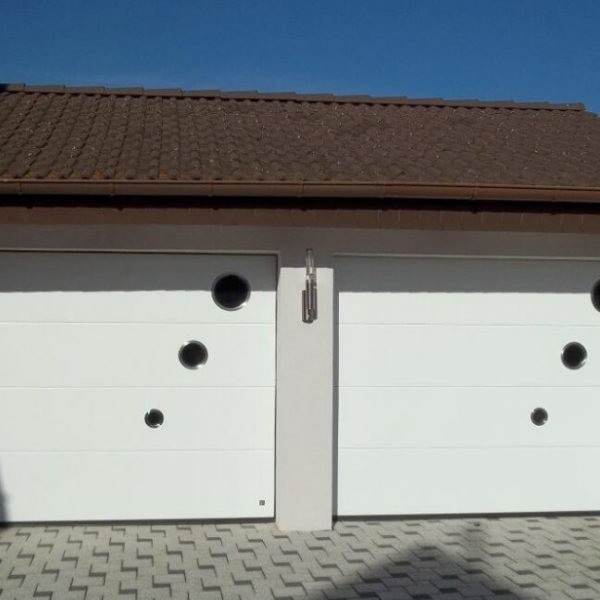 Sectional garage doors with portholes