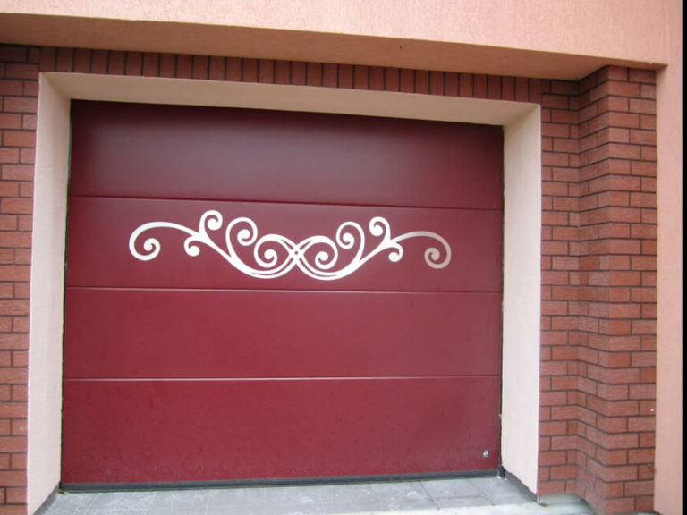 Sectional garage door with custom stainless metal motif