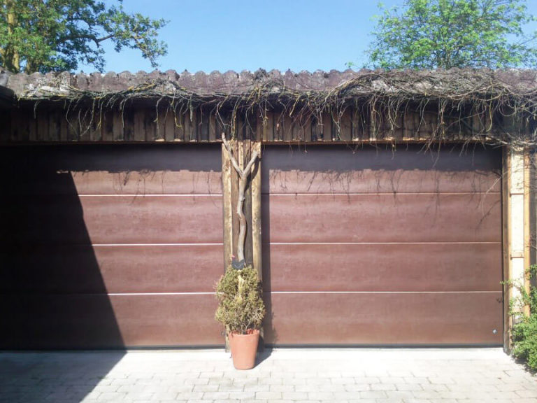 Sectional garage doors with 'Old copper' panels