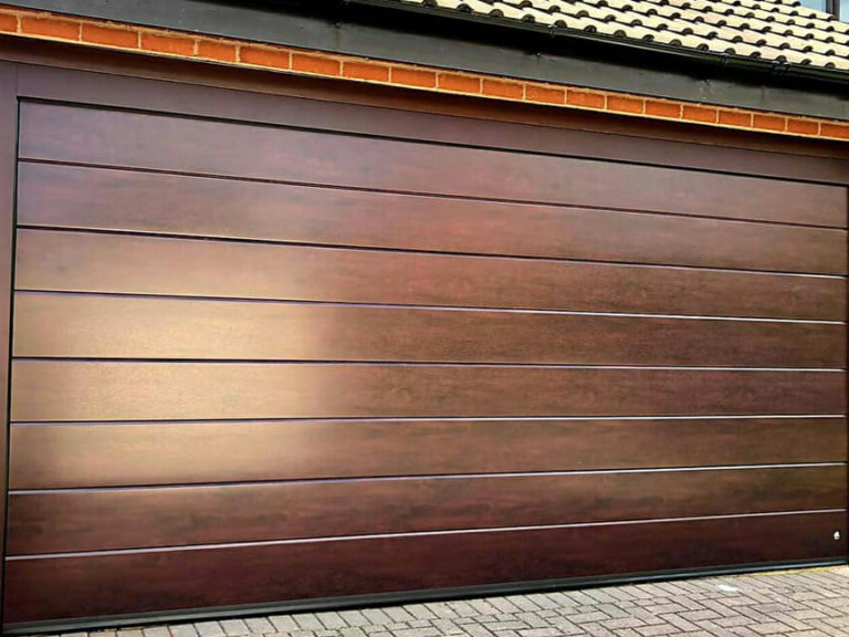 Sectional garage door with aluminium frame
