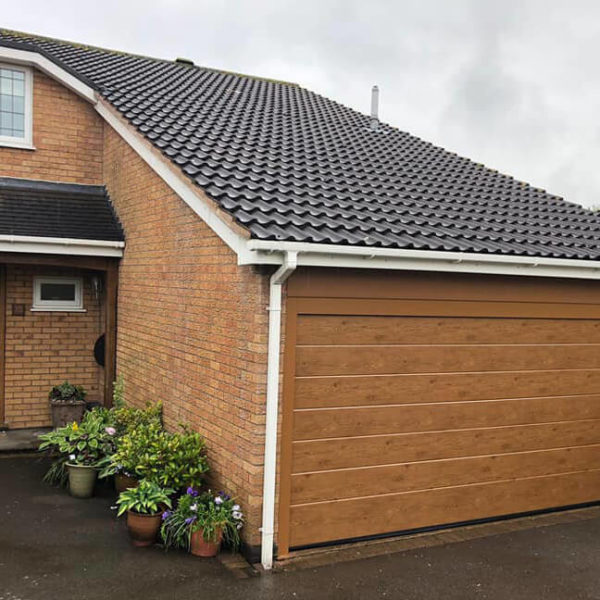 Sectional garage door with aluminium frame