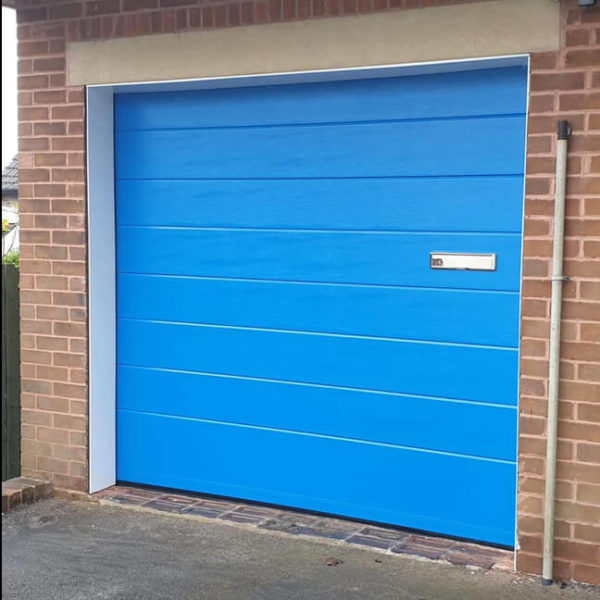 Sectional garage door with letter-box