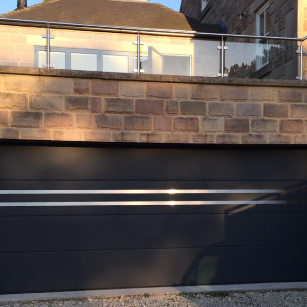 Sectional garage door with decorative accent