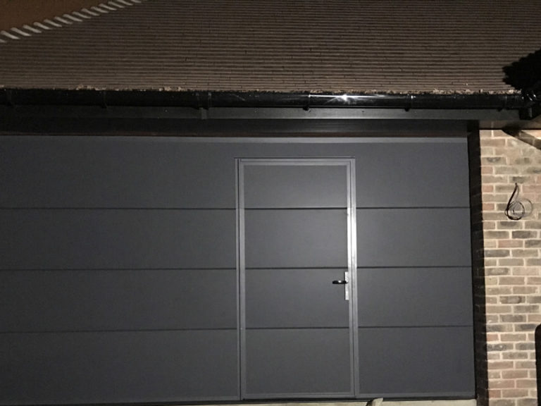 Garage door with wicket