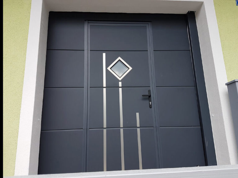 Sectional garage door with wicket & decor