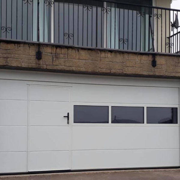 Custom design garage door with wicket