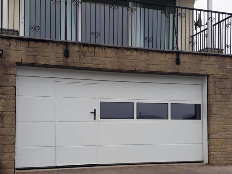 Custom design garage door with wicket