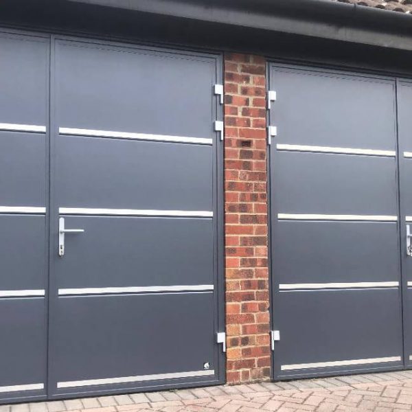 Side-Hinged Garage Doors with stainless metal decor details