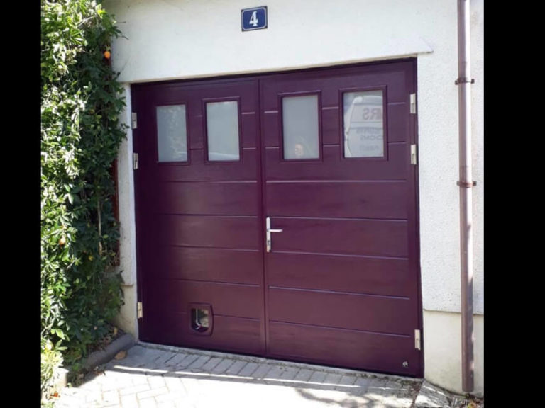 Side hinged garage door with pet-flap