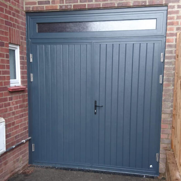 Side hinged door with transom