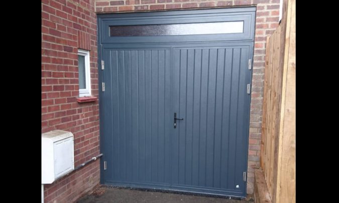 Side hinged door with transom