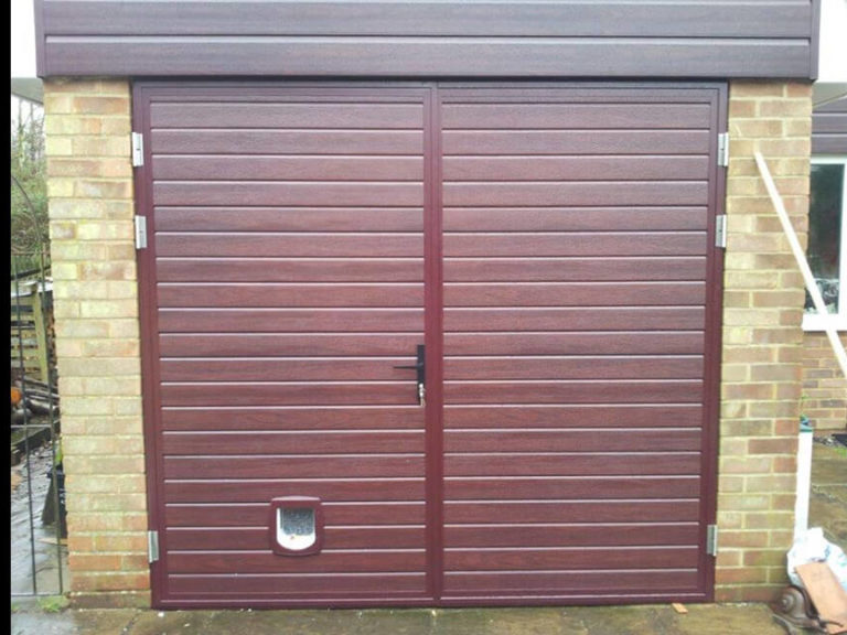 Side hinged door with pet-flap