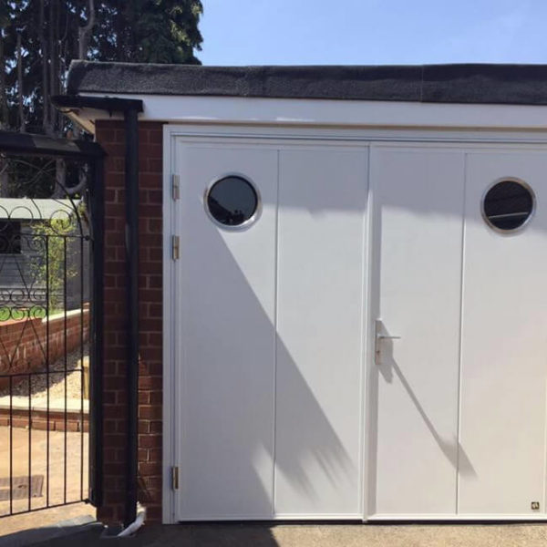 Side hinged door with portholes