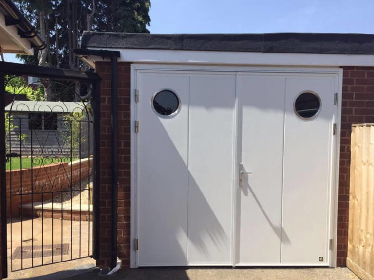 Side hinged door with portholes