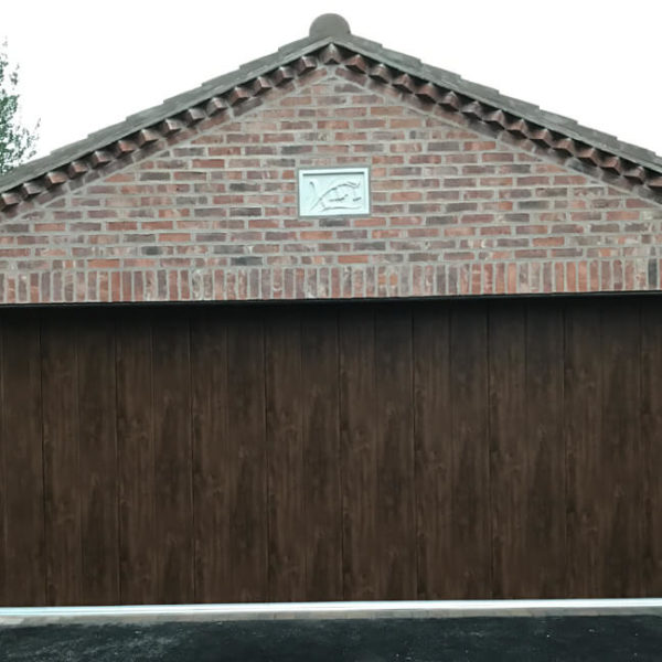 Masonry garage with 'Midrib-slick' door in 'Old Oak' finish