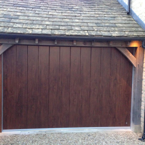 Timber garage with 'Midrib-slick' door in 'Old Oak' finish