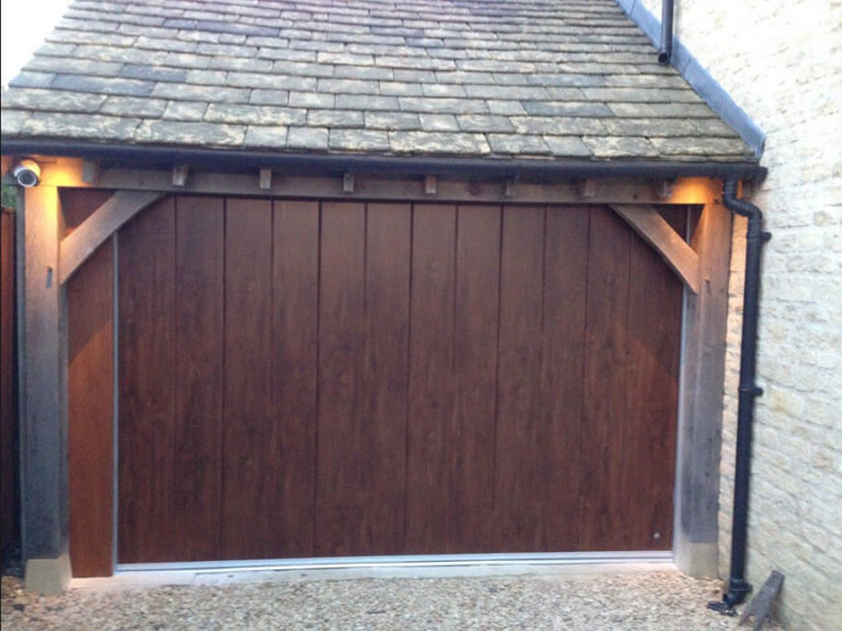 Timber garage with 'Midrib-slick' door in 'Old Oak' finish