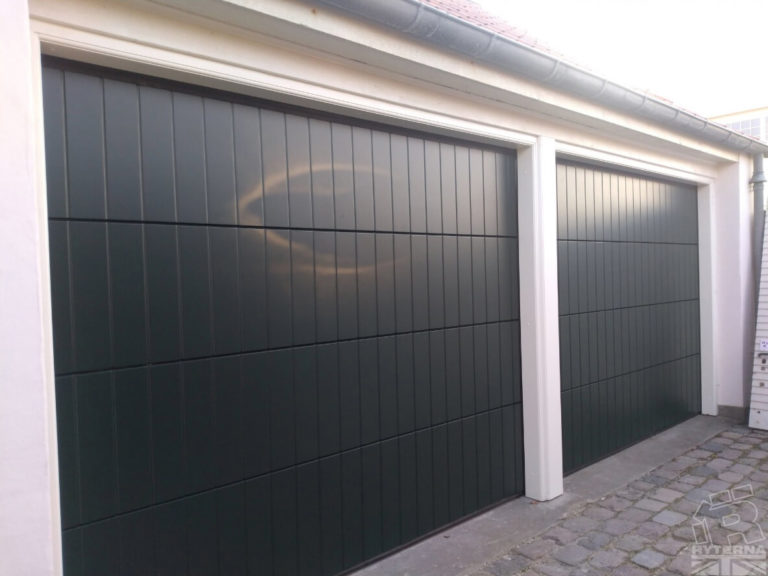 Sectional garage door - okoume clad vertical rib design