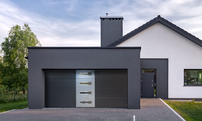 Garage door with oblong windows and applique