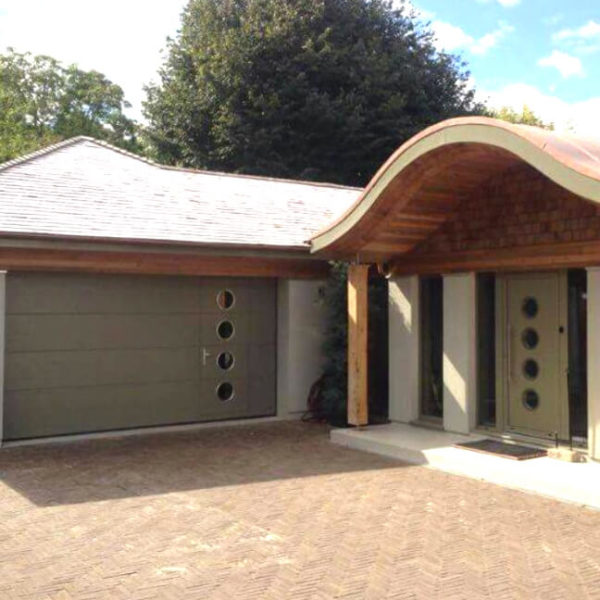 Garage door's wicket with portholes along with same design front door